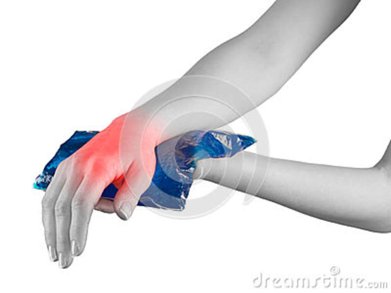 Cool Gel Pack On A Swollen Hurting Wrist  Medical Concept Photo