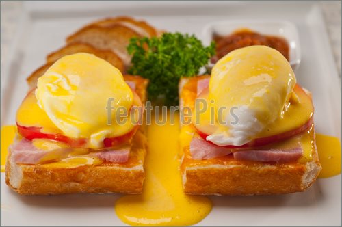 Picture Of Eggs Benedict On Bread With Tomato And Ham  Stock Picture