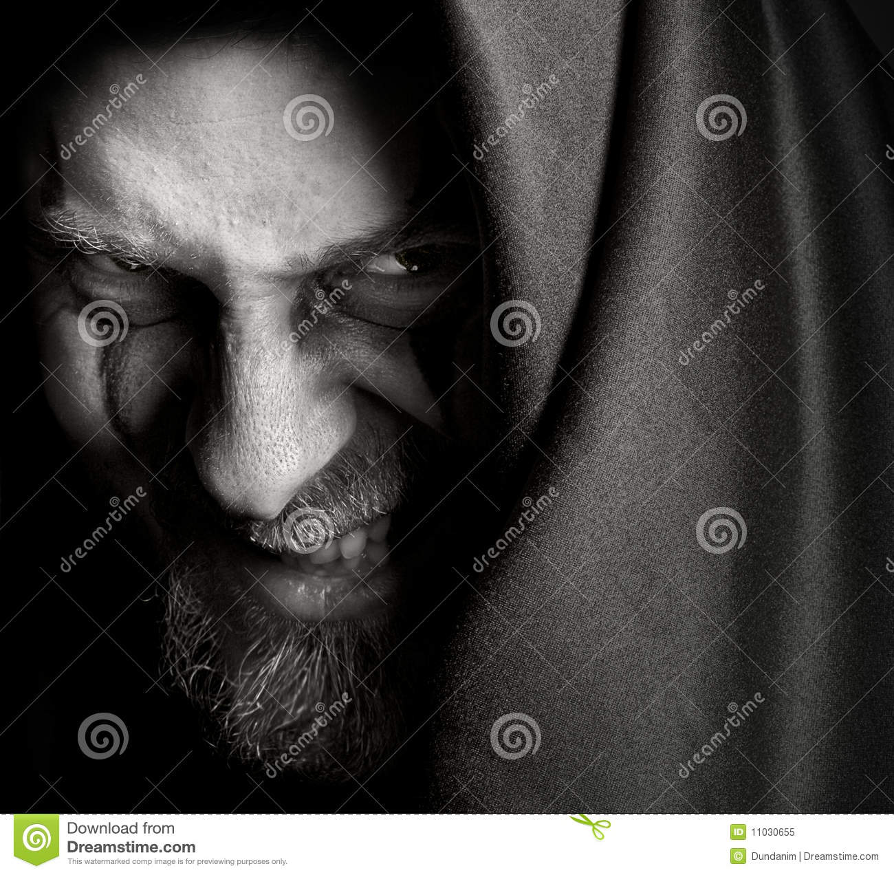 Evil Sinister Man With Malefic Wicked Grin Royalty Free Stock Photo