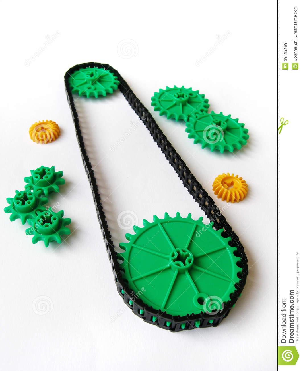 Photograph Showing Some Cogs And Gears Arranged Together With A Belt