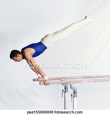 Stock Photo   Young Male Gymnast Performing Routine On Parallel Bars