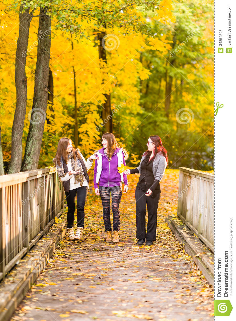 Three Sisters Walking On Bridge And They Have A Fun Together On