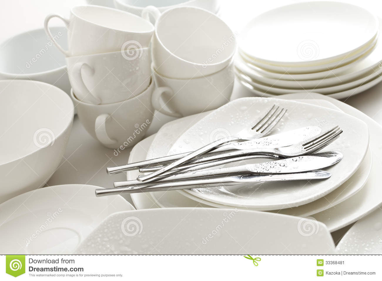 Image Of Kitchen Cutlery And Dishes Piled