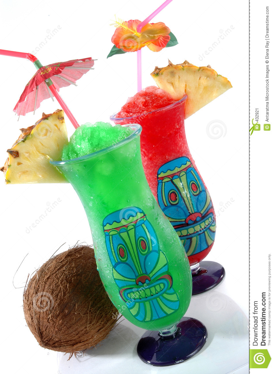 Fun Plastic Tiki Glasses Filled With Colorful Icy Drinks And A Coconut