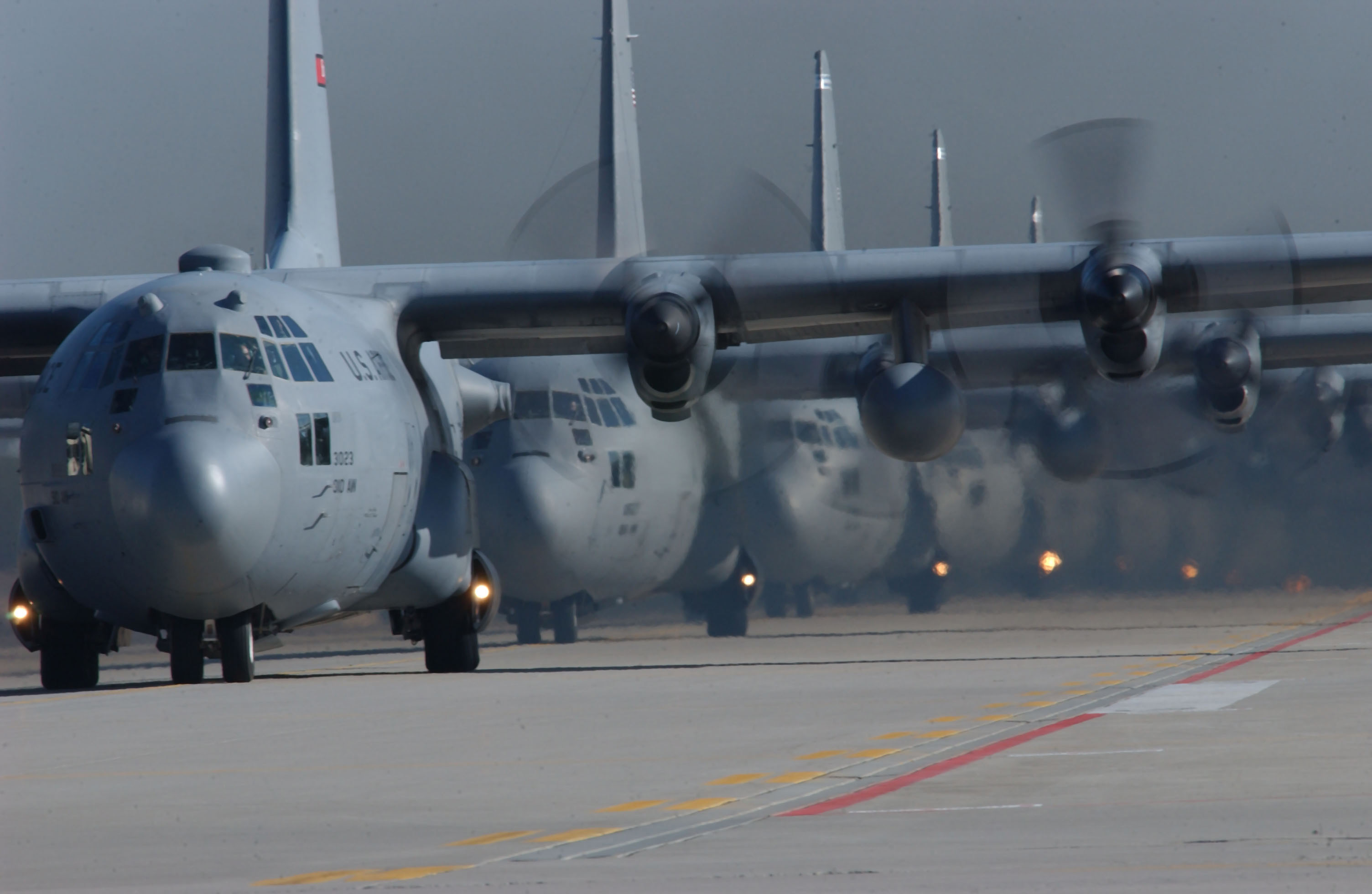 Several C 130 Hercules Aircraft Lined Up Preparing To Take Off Stock